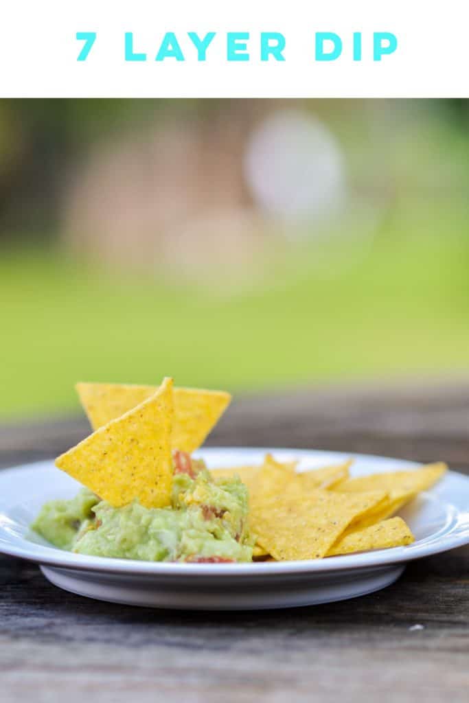 This 7 layer dip is the perfect appetizer for the Big Game. It has guacamole!