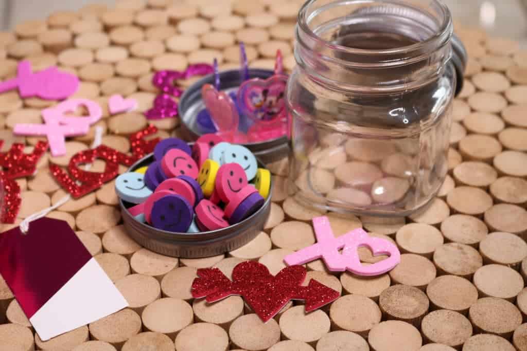 Easy and adorable non-candy Valentine's Day treat for kids requires no candy, just a Mason jar, stickers, stamps and erasers. Super inexpensive!