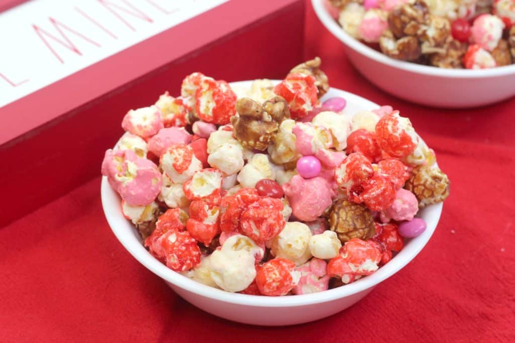 How to make Valentine’s Day popcorn party mix. This easy recipe is yummy and so colorful!