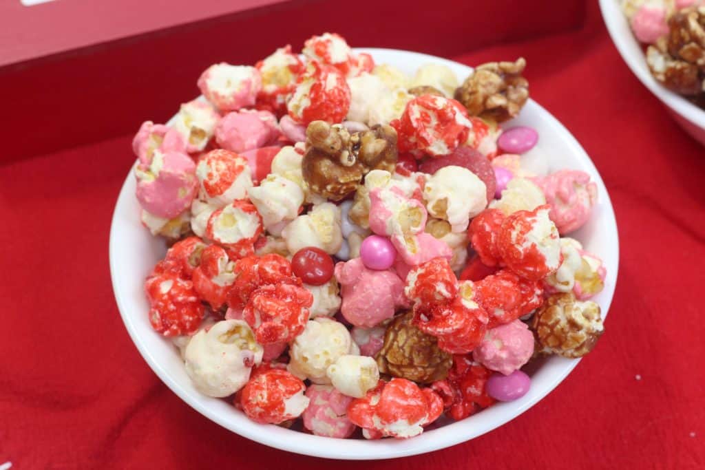 How to make Valentine’s Day popcorn party mix. This easy recipe is yummy and so colorful!
