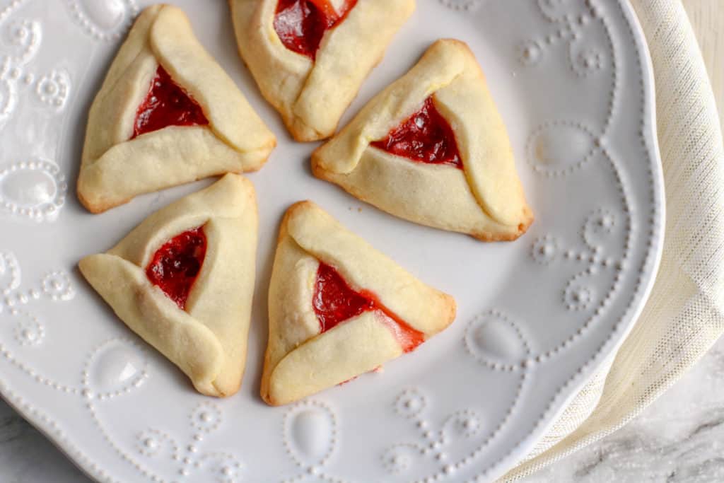 The pastry is usually filled with jelly or chocolate, and I found this great strawberry Hamantaschen recipe that is super easy to make. 