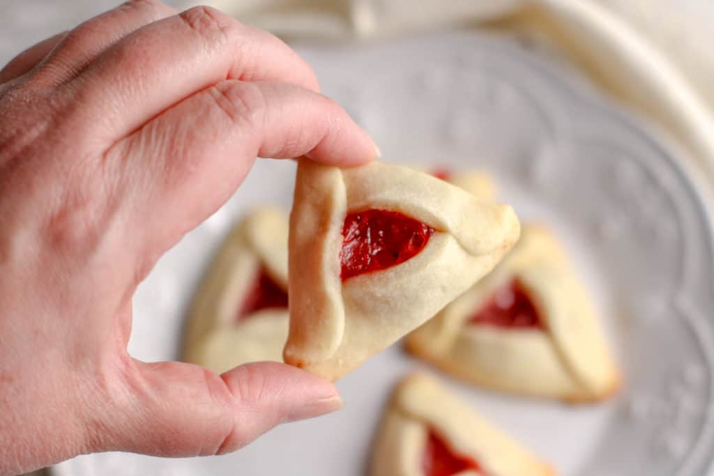 During the Jewish holiday of Purim, it's a tradition to serve cookies resembling Haman's ears. Here is an easy and delicious strawberry Hamantaschen recipe.