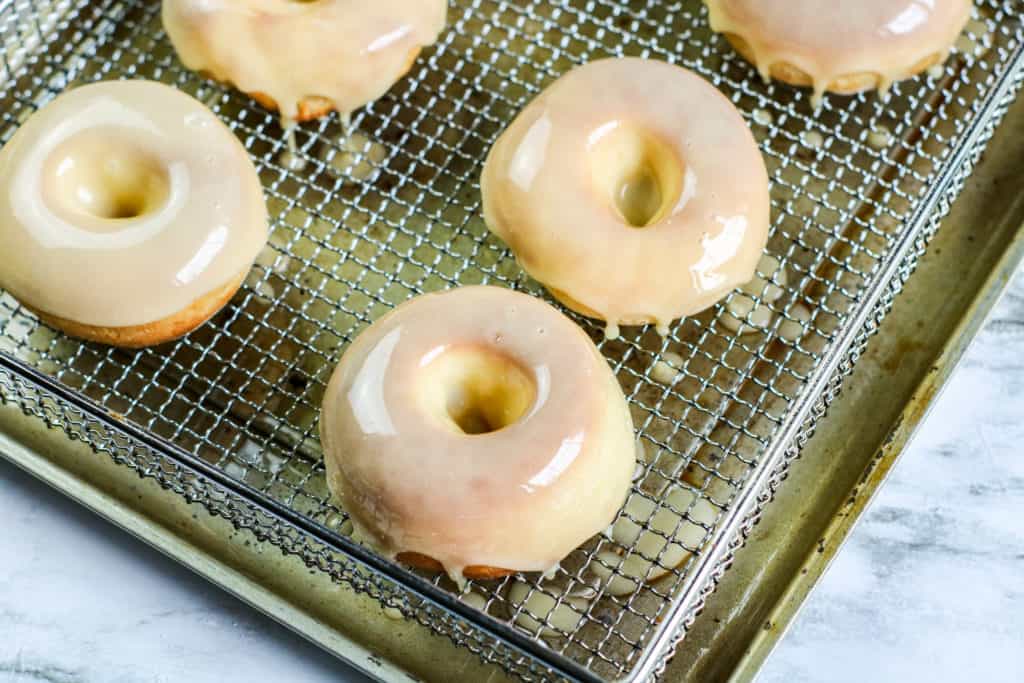 Looking for a homemade yeast donut recipe? This air fryer doughnut recipe produces fluffy and soft glazed treats that taste incredible.