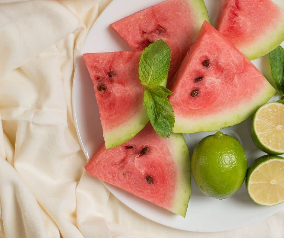 Watermelon slices and limes