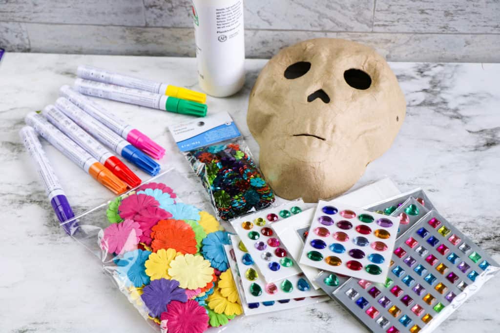 Supplies needed to decorate a Day of the Dead skull