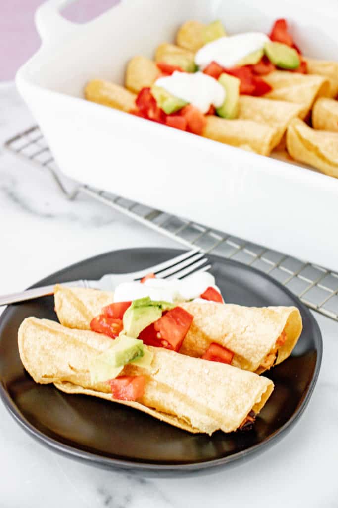 These delicious baked chicken taquitos are easy to make and are a great frezer meal option. 