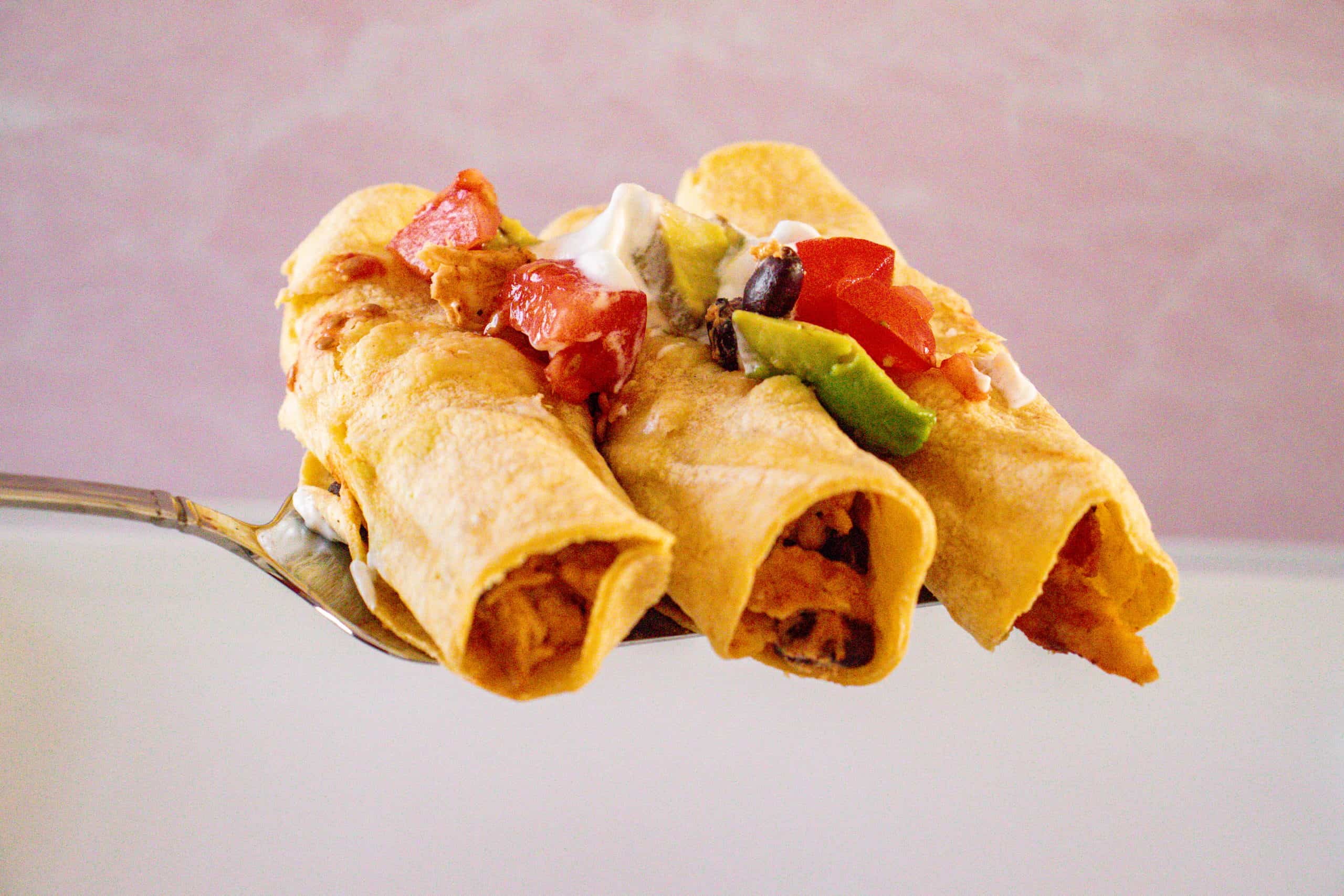 Baked cream cheese shredded chicken taquitos