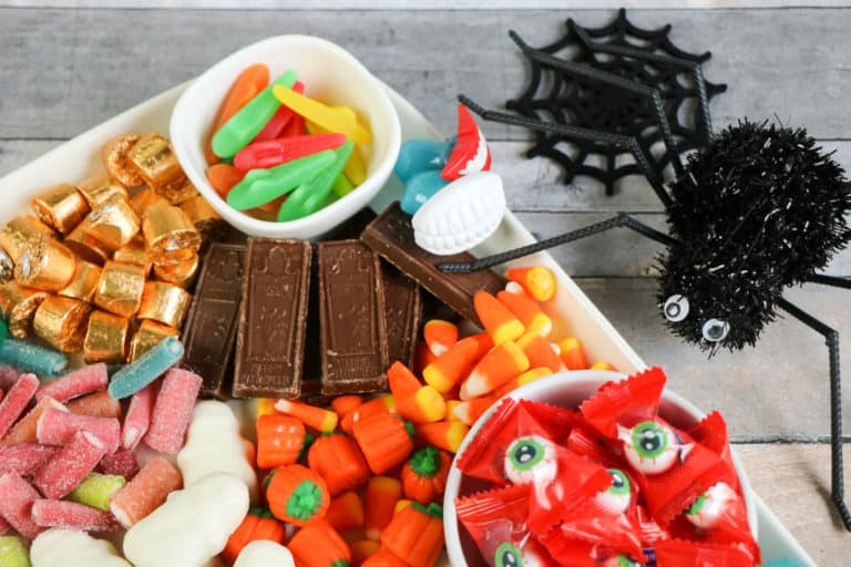 This colorful Halloween candy charcuterie board is the perfect way to serve spooky treats. It's also so easy to make!