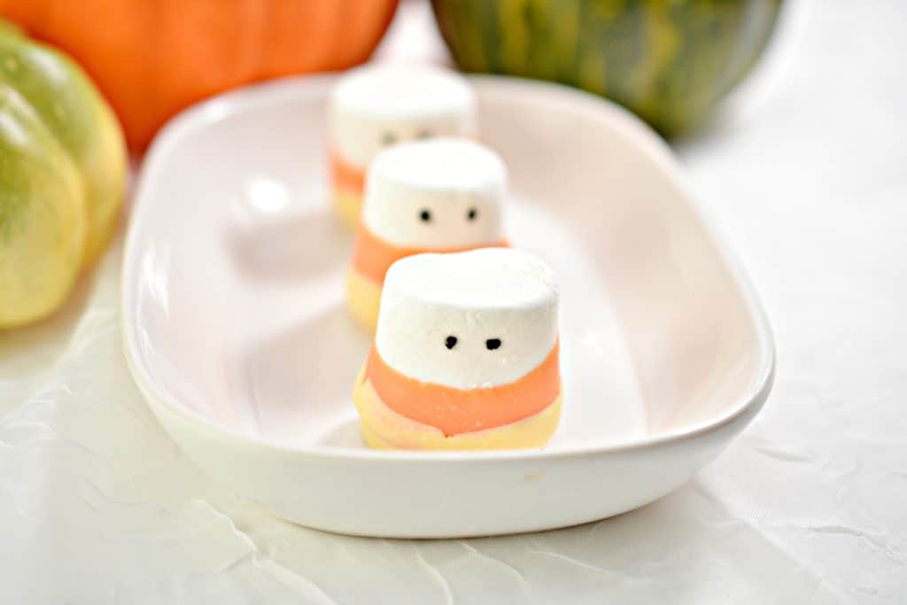 These candy corn marshmallow monsters are super easy to make and are delicious. They look great on any Halloween table!