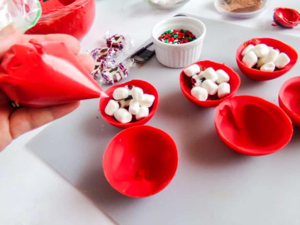 These are the most festive hot cocoa bombs you can make at home. They have hot chocolate, marshmallows, and nougat to create a delightful explosion of flavor and color.