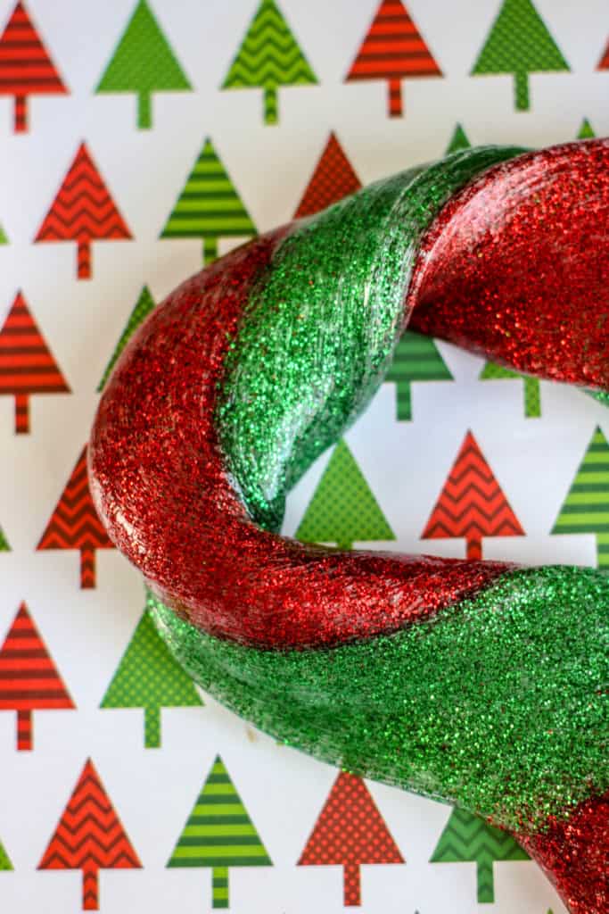 This festive and colorful red and green Christmas slime is super easy to make and so satisfying. Kids love to make it!
