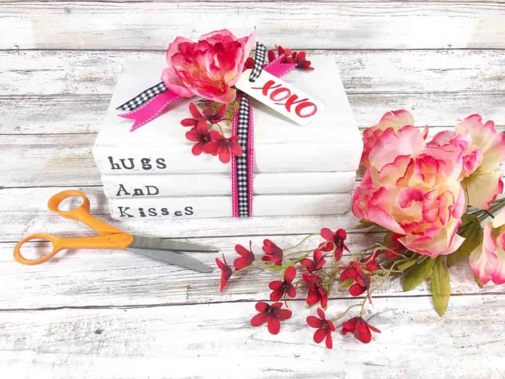 This adorable Hugs and Kisses book stack DIY will instantly allow you to create your own farmhouse style home décor with a sweet message.