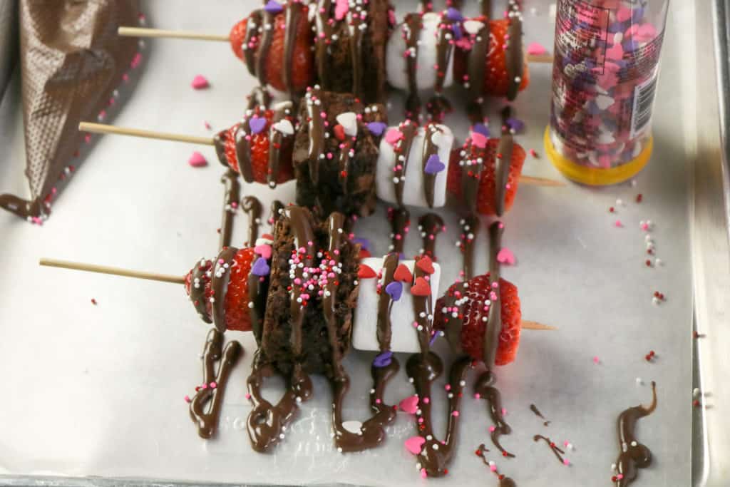 These strawberry brownie kebabs are the easiest Valentine's Day treat. These fruit skewers also have marshmallows and kids love to make them.