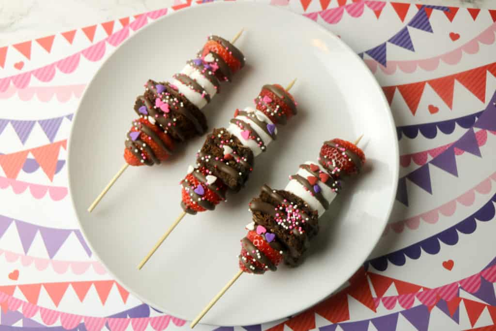 These strawberry brownie kebabs are the easiest Valentine's Day treat. These fruit skewers also have marshmallows and kids love to make them.