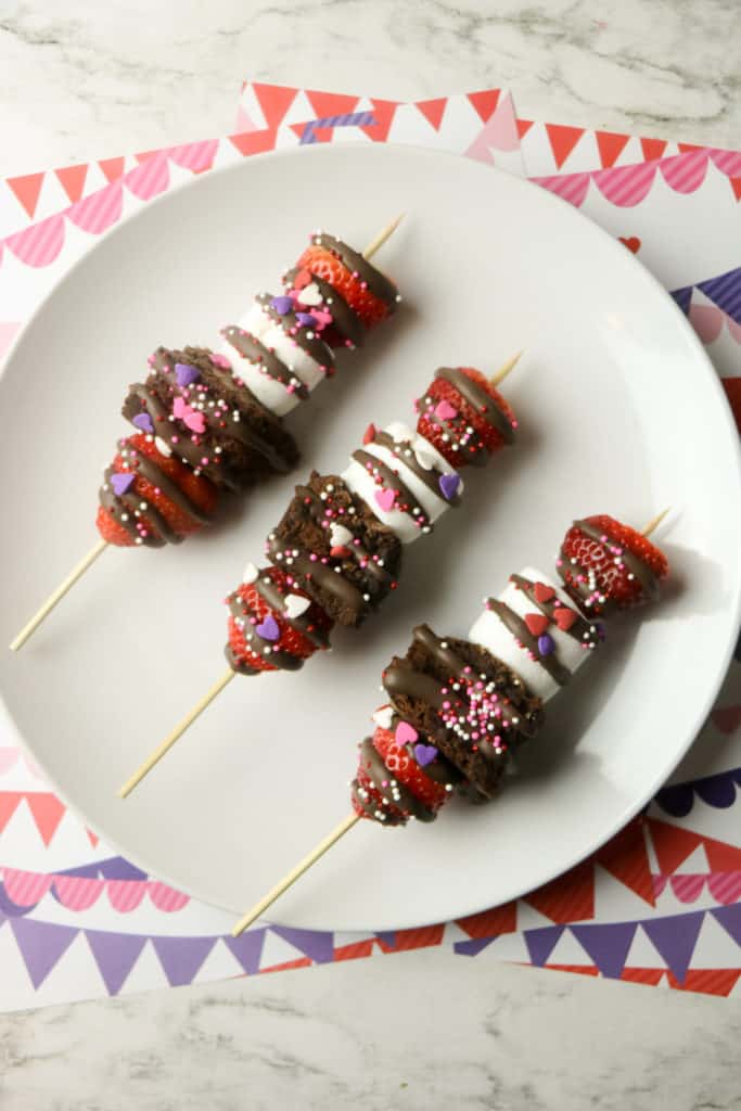 These strawberry brownie kebabs are the easiest Valentine's Day treat. These fruit skewers also have marshmallows and kids love to make them.