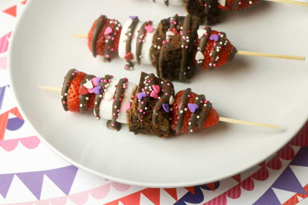 These strawberry brownie kebabs are the easiest Valentine's Day treat. These fruit skewers also have marshmallows and kids love to make them.