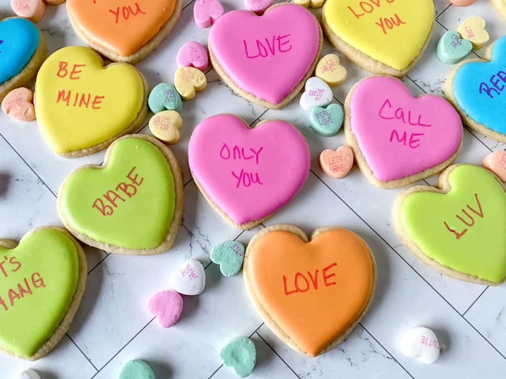 These adorable conversation heart cookies are so easy to make. They're perfect for bridal showers, anniversaries, proposals or Valentine's Day!