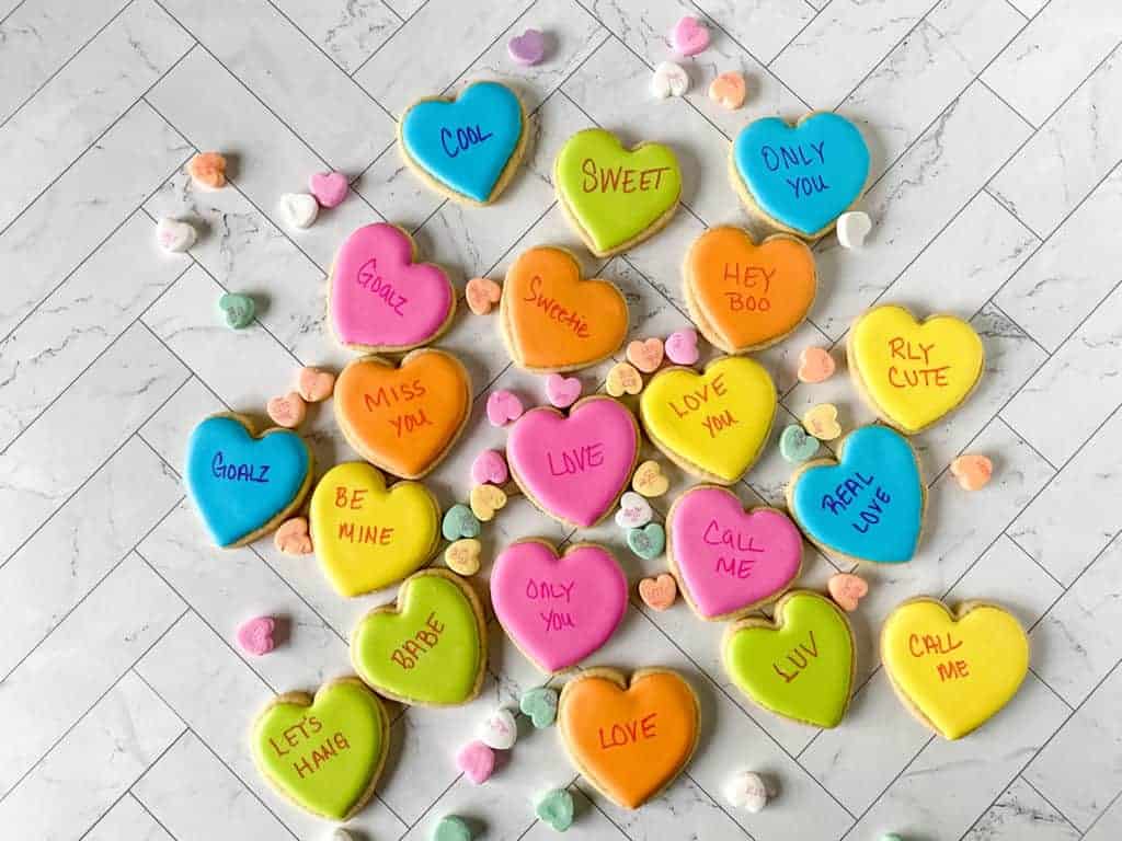 These adorable conversation heart cookies are so easy to make. They're perfect for bridal showers, anniversaries, proposals or Valentine's Day!