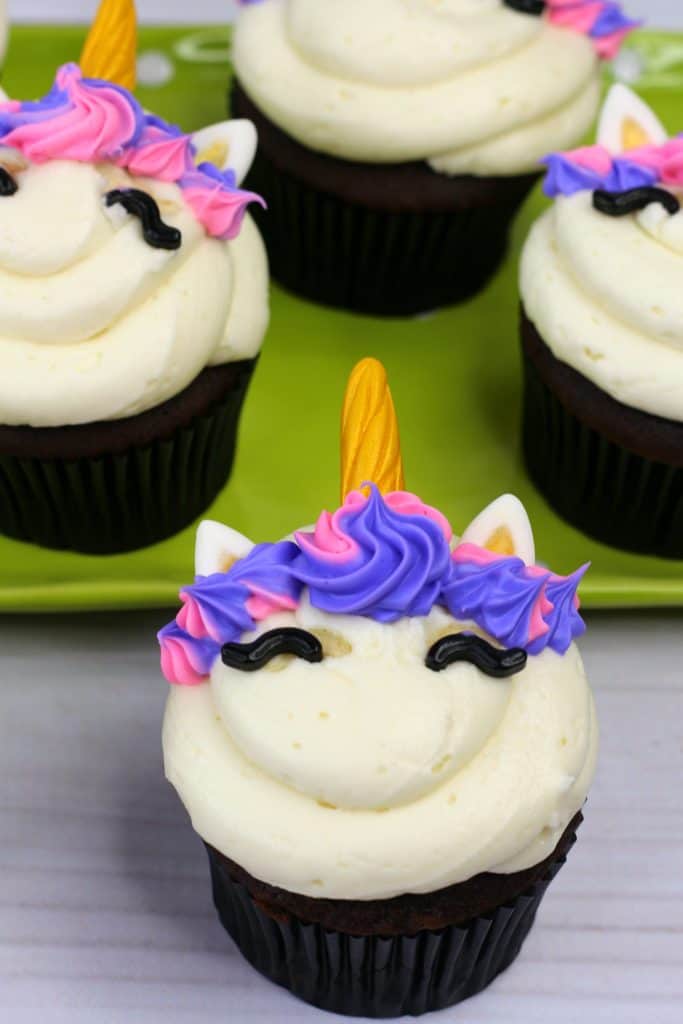 Learn how to bake and decorate unicorn cupcakes at home. You can also use these free printable unicorn cupcake toppers!