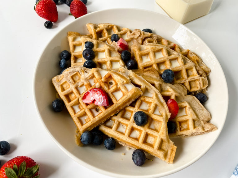 Tres leches waffles are the perfect brunch food. They are soaked in a syrup made from 3 different kinds of milk and garnished with berries. Yum!