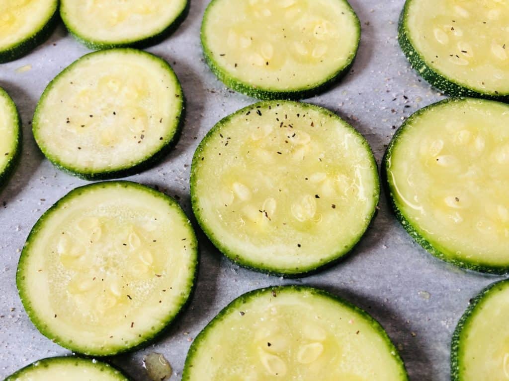 sliced zuchinni brushed with olive oil and seasoned with pepper and salt. 