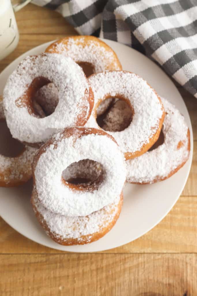 birds eye image of a powdered sugar biscuit donuts