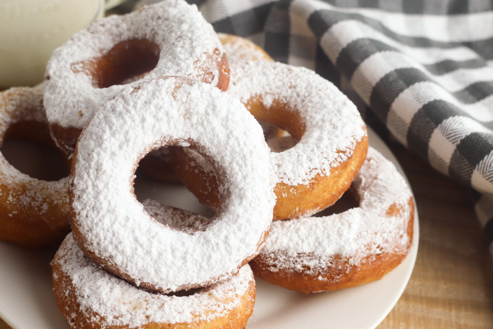 Powdered Sugar Biscuit Donuts are so easy to make, but yet so delicious. These homemade donuts are perfect for a quick snack for the family.