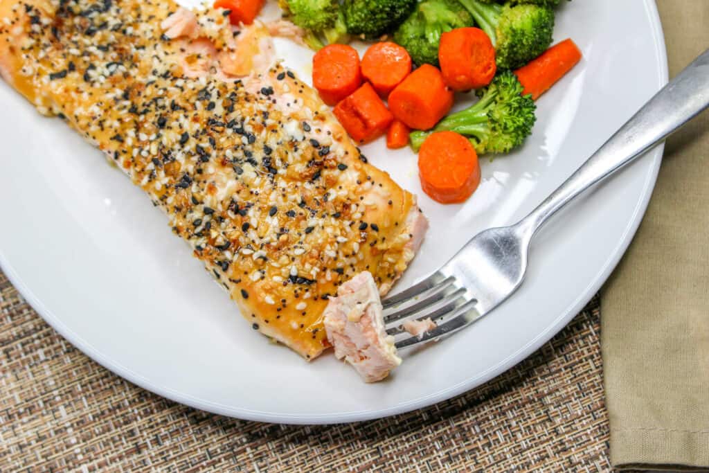 Healthy and delicious, this sheet pan salmon dinner is super easy to make.