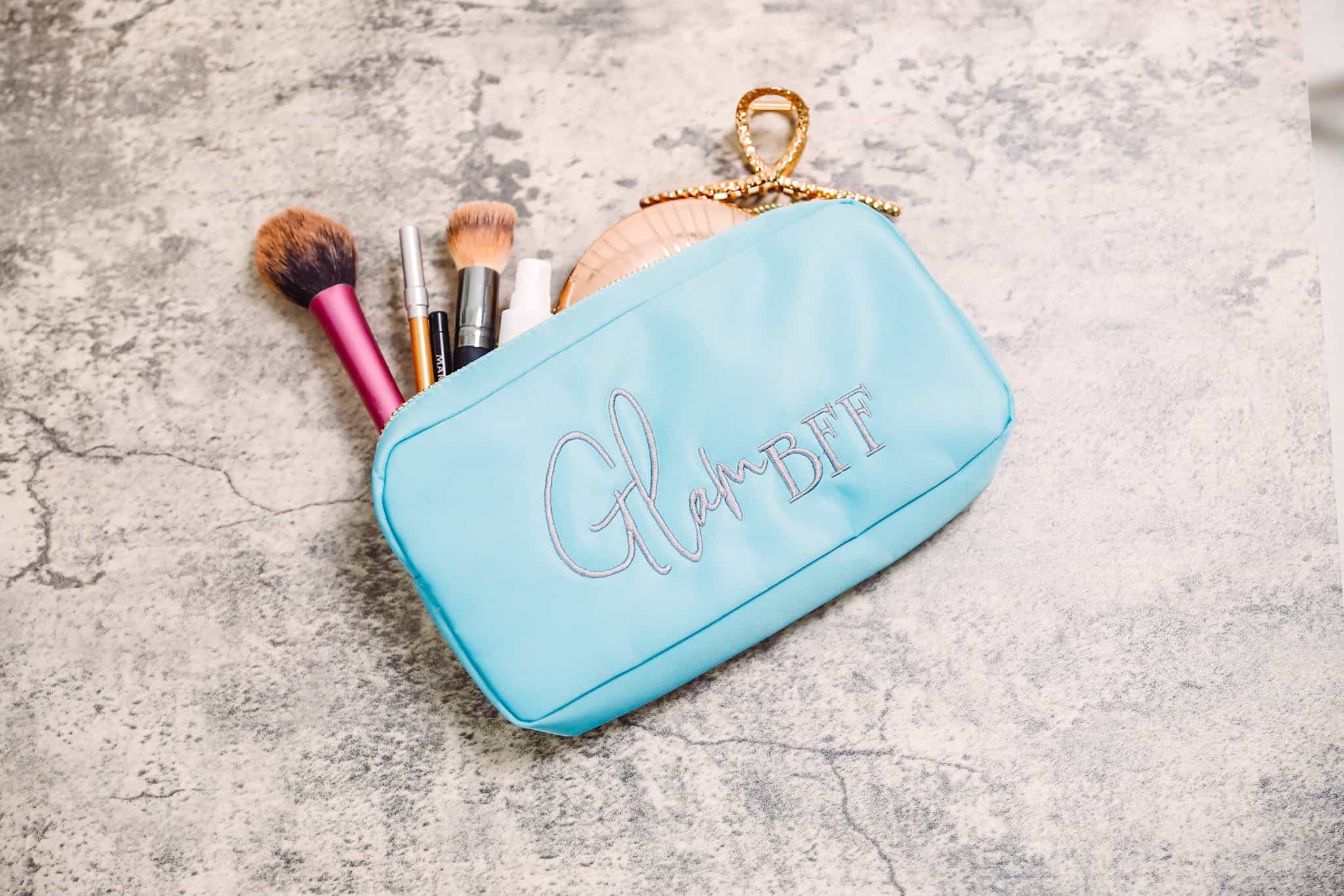 Avoid overpacking with this handy list of what to take in your travel makeup bag.