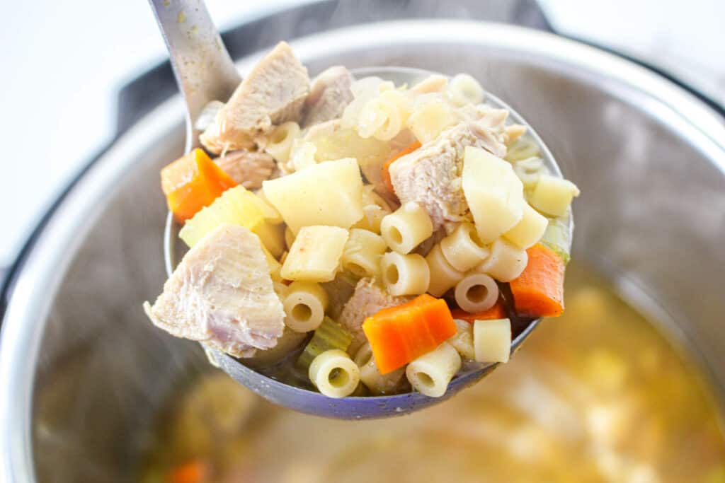 This easy Instant Pot turkey soup recipe will delight the whole family and is the perfect way to use Thanksgiving leftovers.