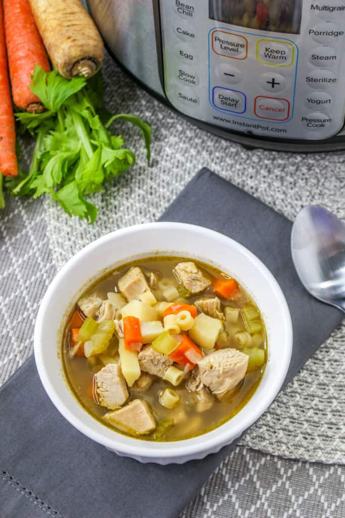 This easy Instant Pot turkey soup recipe will delight the whole family and is the perfect way to use Thanksgiving leftovers.