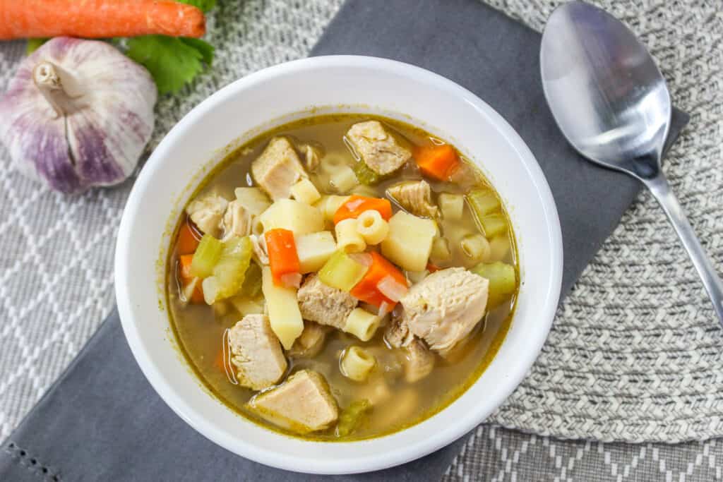 This easy Instant Pot turkey soup recipe will delight the whole family and is the perfect way to use Thanksgiving leftovers.