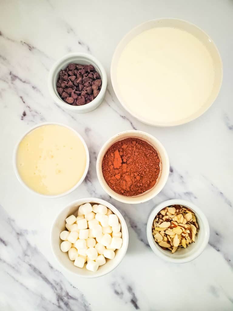 Indulge in the rich and creamy goodness of homemade rocky road ice cream without the need for an ice cream maker! These are the ingredients.