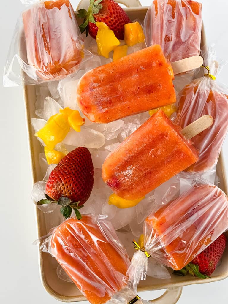 This delightful recipe for homemade strawberry mango popsicles is bursting with natural fruit flavors and requires just four simple ingredients.