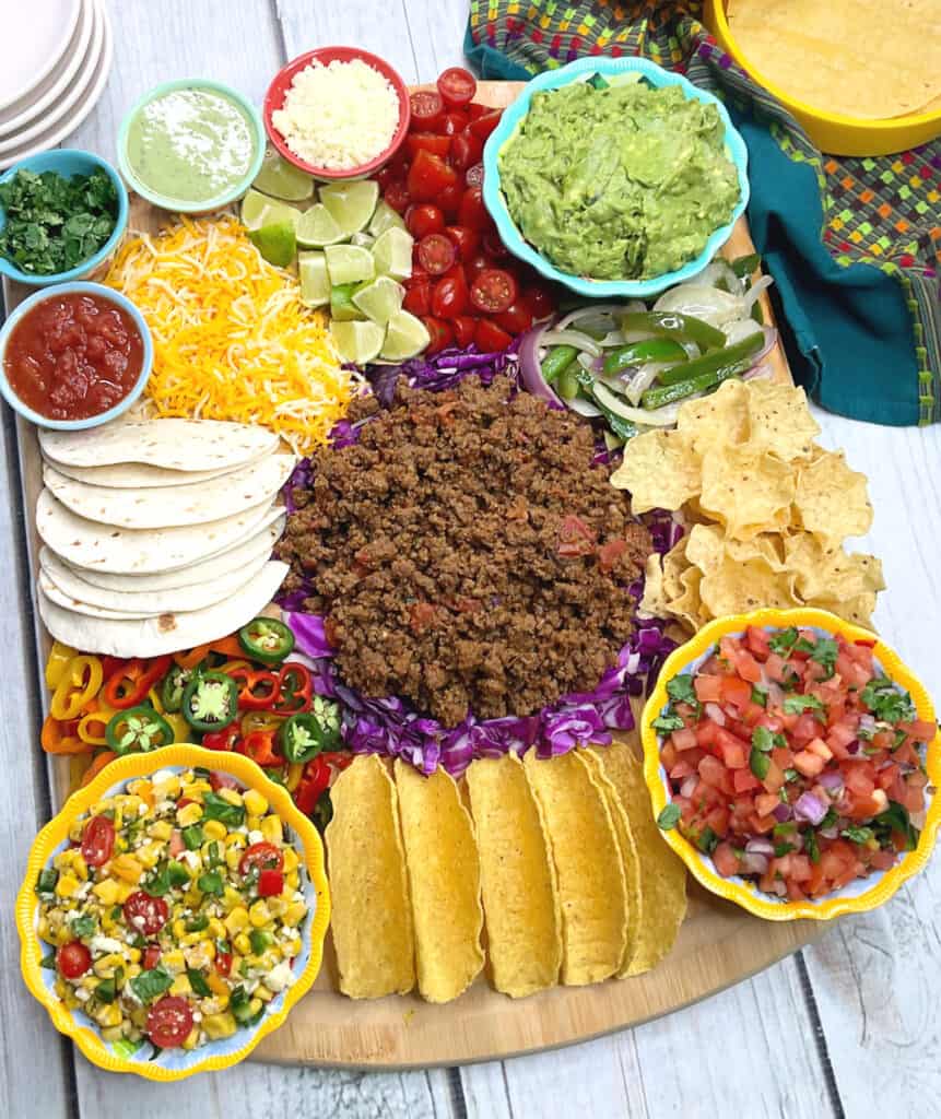 Create the ultimate Taco Charcuterie Board with our step-by-step guide. From savory taco meat to zesty guacamole, vibrant pico de gallo, and a variety of toppings, this flavor-packed fiesta will impress your guests. Get ready for a mouthwatering experience that combines the art of charcuterie with the vibrant flavors of tacos.