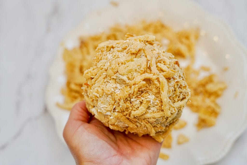 This delicious French Onion Cheeseball is the perfect appetizer to elevate your gatherings and impress your guests. Combining the rich flavors of French onion soup mix with creamy goodness, this easy cheese ball recipe is a crowd-pleaser that's incredibly easy to make in just 10 minutes. 