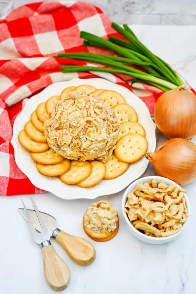 This delicious French Onion Cheeseball is the perfect appetizer to elevate your gatherings and impress your guests. Combining the rich flavors of French onion soup mix with creamy goodness, this easy cheese ball recipe is a crowd-pleaser that's incredibly easy to make in just 10 minutes. 