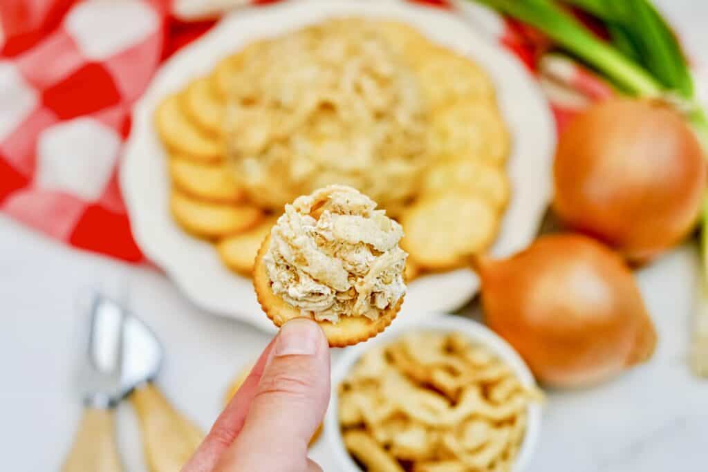 This delicious French Onion Cheeseball is the perfect appetizer to elevate your gatherings and impress your guests. Combining the rich flavors of French onion soup mix with creamy goodness, this easy cheese ball recipe is a crowd-pleaser that's incredibly easy to make in just 10 minutes. 