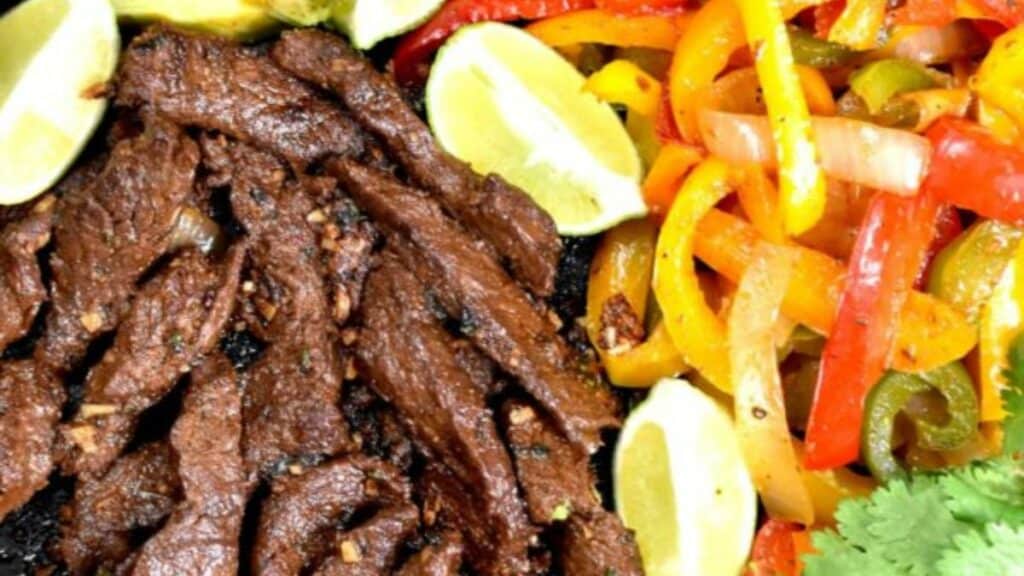 Steak and peppers on a plate.