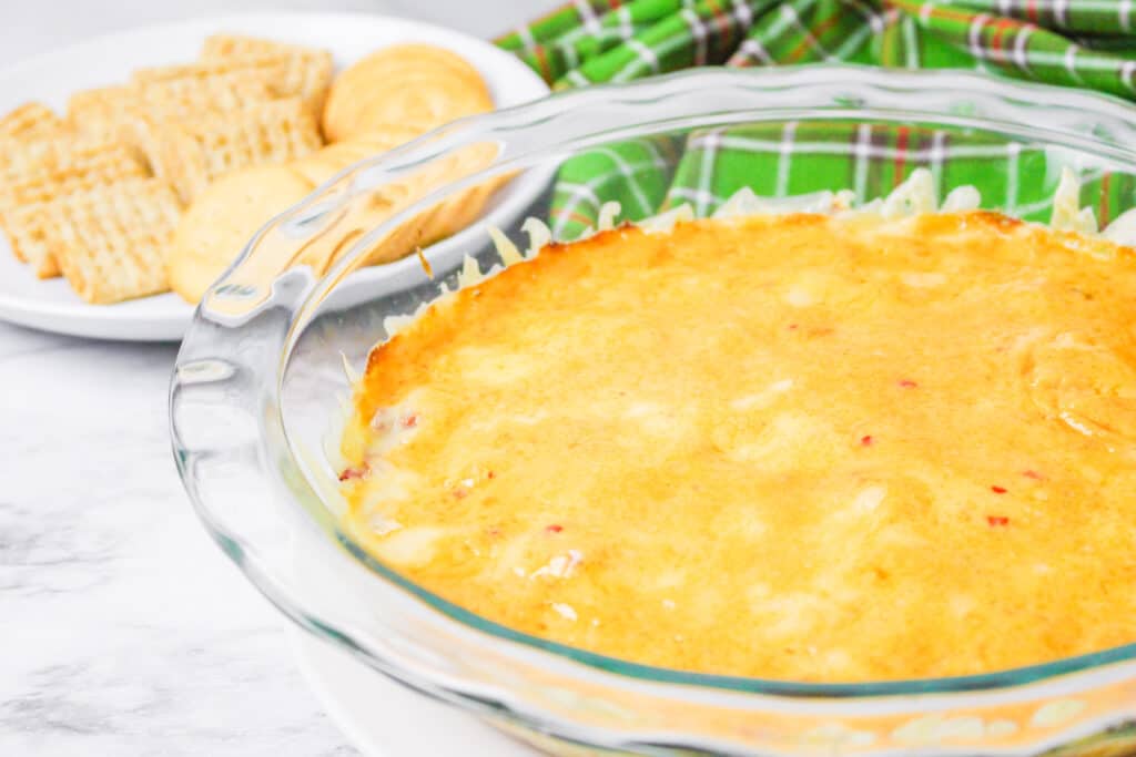 This easy hot Reuben Dip recipe is the perfect appetizer. It brings together the flavors of savory corned beef, sauerkraut and creamy Thousand Island dressing.