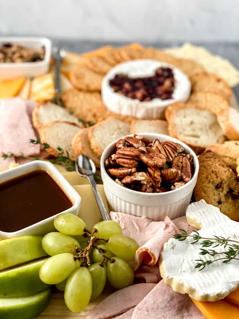 Creating a stunning Thanksgiving charcuterie board is a fun way to start your holiday season feast. It is the perfect appetizer and adds a beautiful element to your holiday table. 