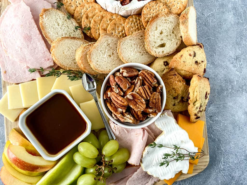 Creating a stunning Thanksgiving charcuterie board is a fun way to start your holiday season feast. It is the perfect appetizer and adds a beautiful element to your holiday table. 