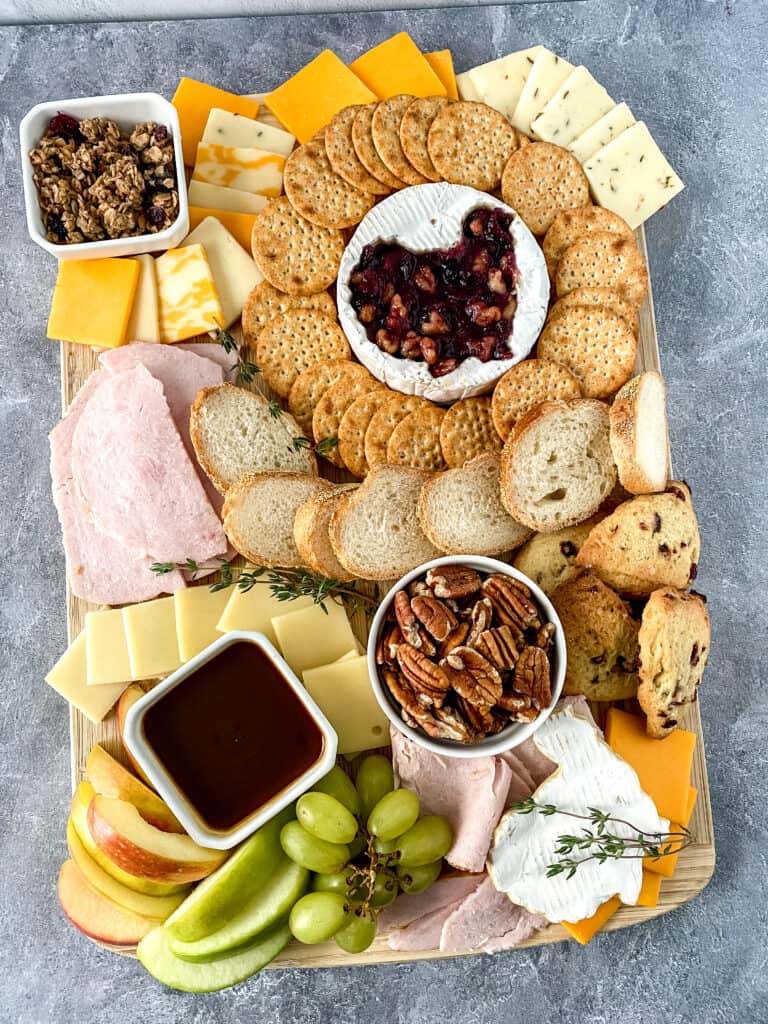 Creating a stunning Thanksgiving charcuterie board is a fun way to start your holiday season feast. It is the perfect appetizer and adds a beautiful element to your holiday table. 