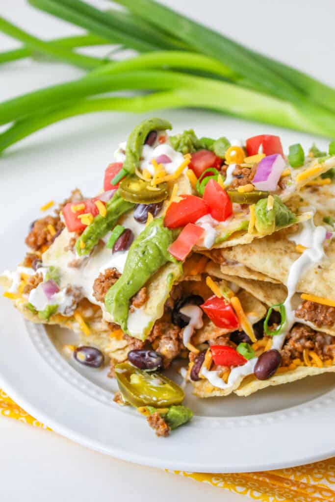 Score big on game day with our epic Trash Can Nachos recipe! Layered with crispy tortilla chips, gooey queso, savory taco meat, and fresh toppings, this crowd-pleaser is easy to make and even easier to devour.