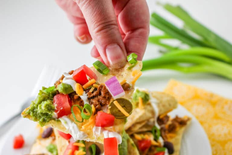 Score big on game day with our epic Trash Can Nachos recipe! Layered with crispy tortilla chips, gooey queso, savory taco meat, and fresh toppings, this crowd-pleaser is easy to make and even easier to devour.