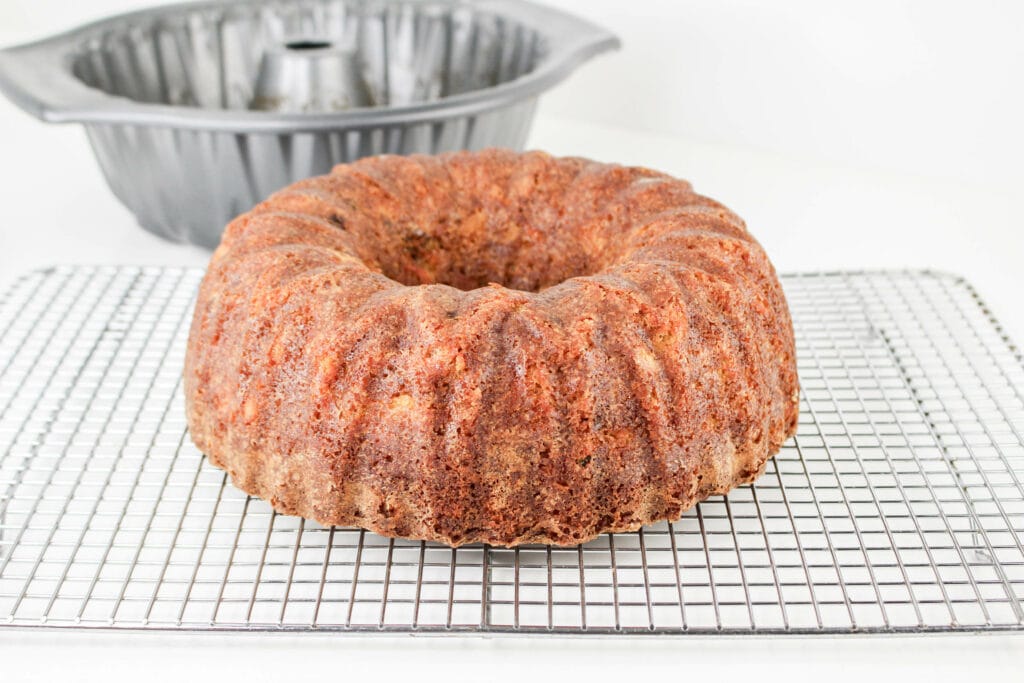 This easy carrot pound cake is perfection. The homemade cream cheese frosting is drizzled on top for the most delicious, moist and satisfying cake.