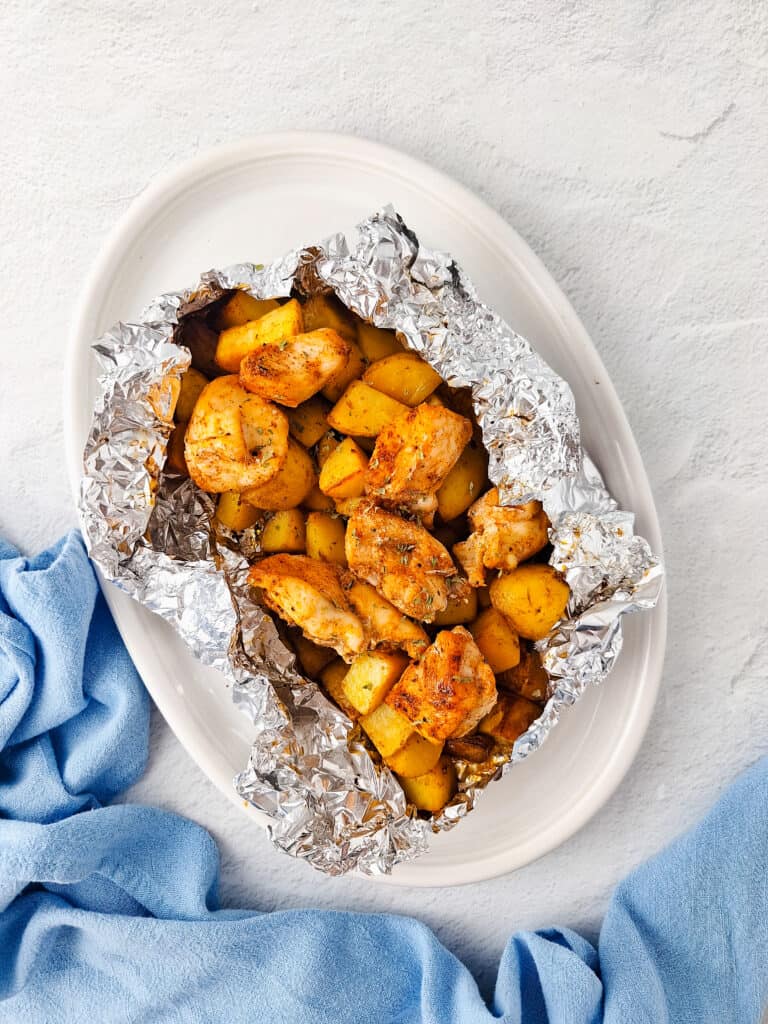 Using aluminum foil helps create delicious and easy meals in just minutes,  like these chicken and potato foil packets. Baked in the air fryer oven, the tender chicken comes out so juicy that it will delight the whole family. 